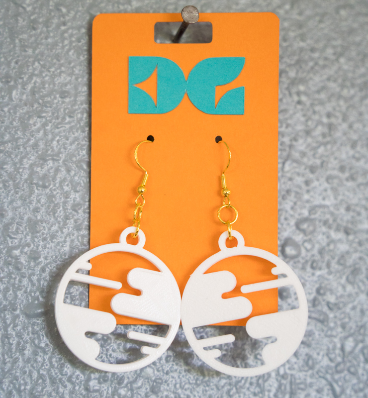 white small world earrings