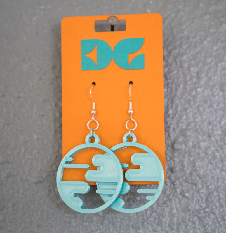 teal small world earrings