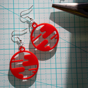 red small world earrings