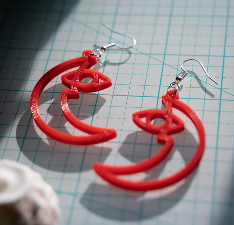 red waxing moon earring